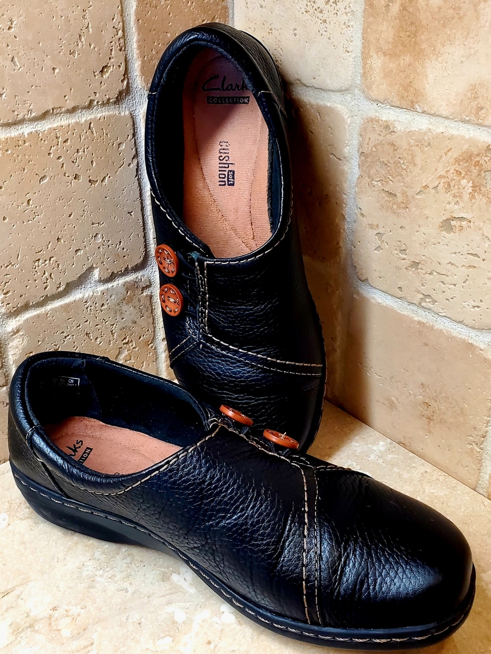 Clarks Black Leather Women's Slip-Ons with Brown Button Accents Size 7M